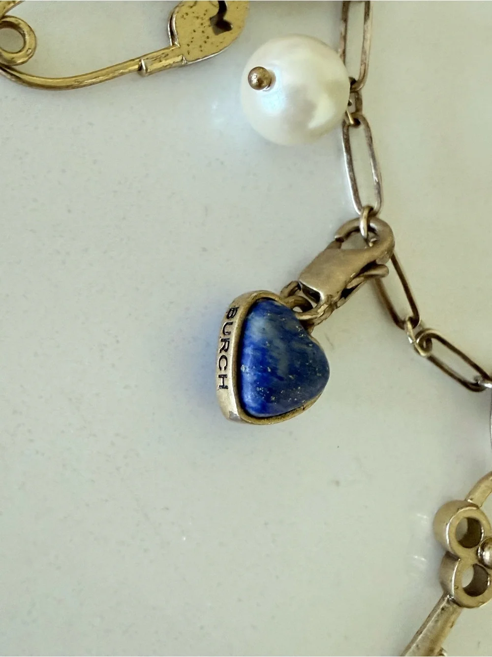 Gold tone Tory Burch beautiful bracelet with charms.